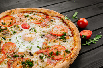 Fresh carbonara pizza with scrambled egg on wooden background
