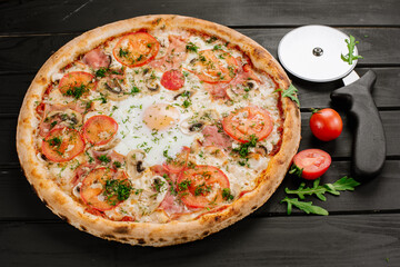 Fresh carbonara pizza with scrambled egg on wooden background