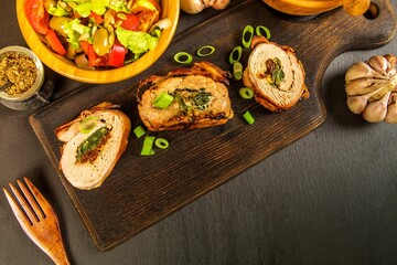  Roast pork tenderloin stuffed with spinach and sun - dried tomatoes. Diet food. Home cooking. Pork tenderloin.