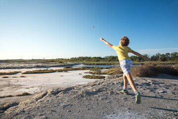 Child throws a stone