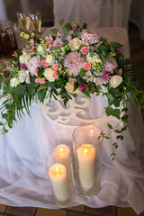 Floral arrangement for wedding table with candles