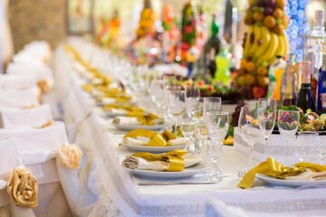 Large banquet table with server dishes in the restaurant