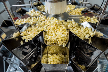 Vertical multi-head weigher packaging machine snacks and chips in a factory