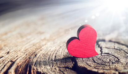 Wooden Heart With Sunlight And Flare Effect In Defocused Background - Valentines Day 