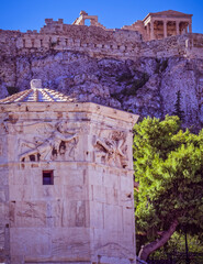 Athens Greece, ancient temples on Acropolis hill and the winds tower in the roman forum, view from...