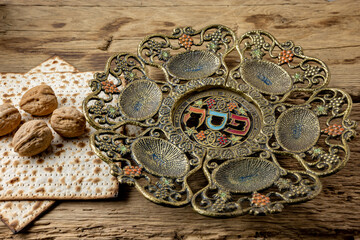 
Passover holiday concept with  matzoh and traditional Pesah plate . Selective focus.
