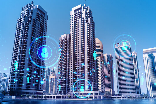 Skyscrapers of Dubai business downtown. International hub of trading and financial services. Social network icons hologram, concept of people connection. Double exposure. Dubai Canal waterfront.
