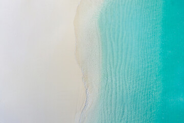 Summer seascape beautiful waves, blue sea water in sunny day. Top view from drone. Sea aerial view,...