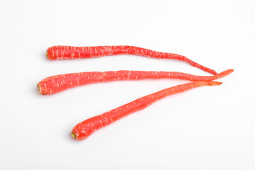 Fresh red carrot bunch on white background