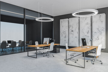 Grey office room with chairs and computer on wooden tables, tiled floor