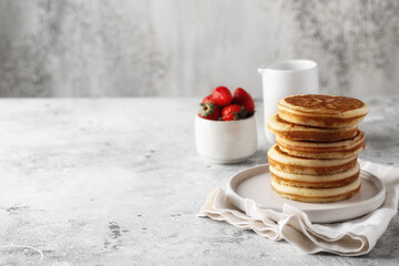 Suck of Classic American style Pancakes on light background for breakfast.Copy space