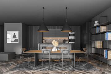 Gray and wooden kitchen with table and bookcase