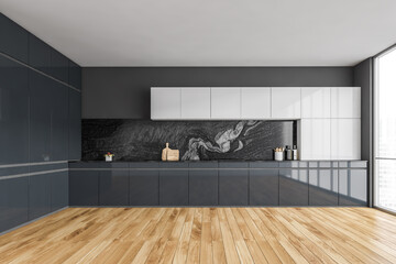 Black and wooden empty kitchen with parquet floor and window