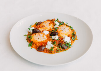 dish scrambled eggs olives feta cheese white