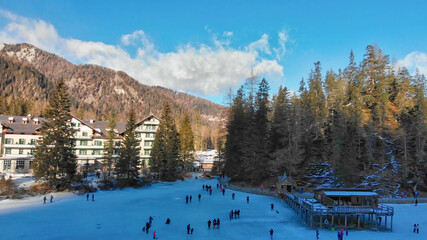 Braies Lake blotted in winter, aerial view from drone, Italian Alps