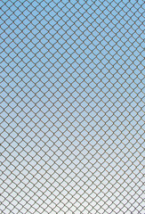 Naklejka premium Iron net on the sky background