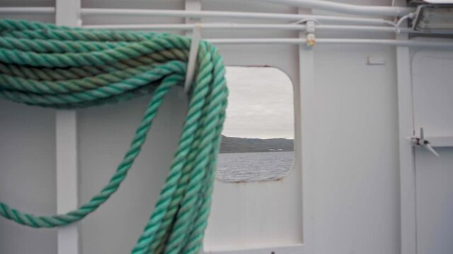 Old Rugged Boat Rope On Vessel Sailing During Daytime In Norway. - Close Up