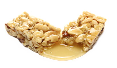 Nut bar, peanuts, almond, walnut, cereals and honey isolated on white background