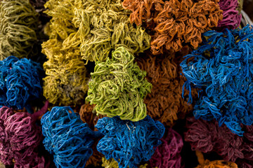 Colored dried seaweed shaped into decorative balls