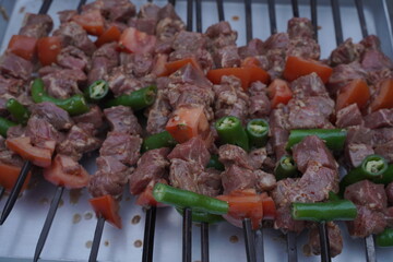 Garbage skewers ready to be barbecued.