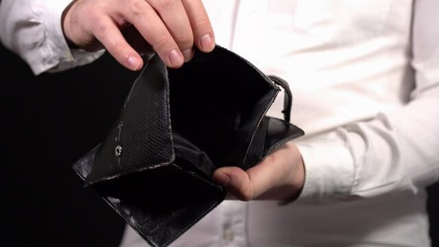 Show Empty Wallet. Man Showing Empty Old Wallet. Demonstrate their Insolvency.