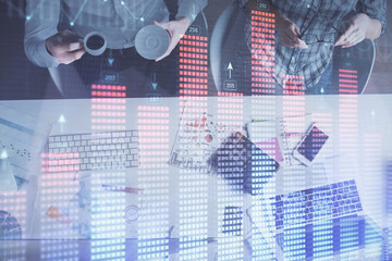 Double exposure of man and woman working together and financial chart hologram drawing. market analysis concept. Computer background. Top View.