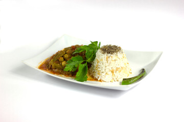 Okra with rice and parsley in a white plate