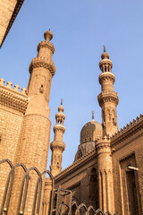 Fototapeta na wymiar Minarets of the the Rifai and Sultan Hassan Mosques in Cairo, Egypt