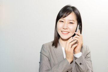 Woman calling for work with a smile