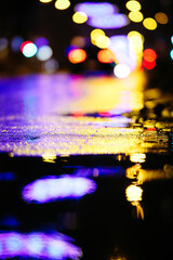 Beautiful night city lights and traffic lights, public transportation in night. Blurred background. Selective focus