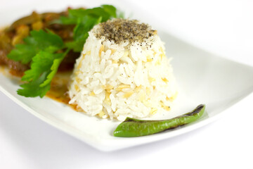 Rice pilaf and okra in a white plate