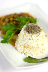 Rice pilaf and okra in a white plate