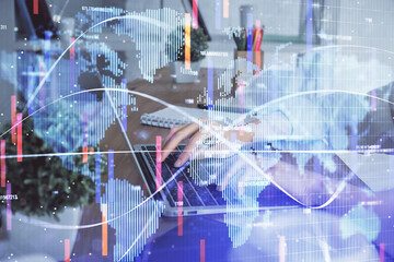 Double exposure of woman hands typing on computer and business theme hologram drawing. Success...