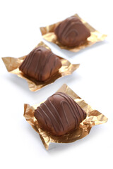 Chocolate praline on the white background