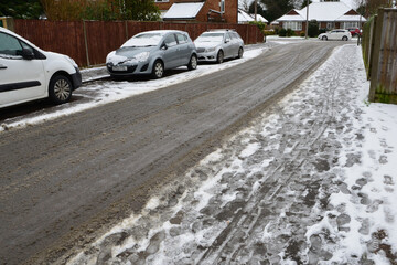 Slush on a road after Snow on 24 january 2021 in Horley Surrey in the Uk.