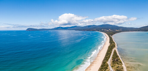 High angle aerial drone view of the Neck, an isthmus of land connecting north and south Bruny Island in southern Tasmania, Australia that offers 360 degree views and is a famous tourist destination.