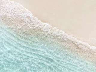 Fotobehang Aerial top view of beautiful tropical white sand beach with wave foam and transparent sea, Summer vacation and Travel background with copy space, Top view from drone © Kittiphan