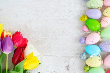 Easter colored eggs with tulips