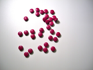 Tablets (dietary supplements) on a white background