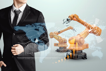 Image of a male businessman in a suit and robotic arms. Iot technology concept, smart factory. Digital manufacturing operation. Industry 4.0