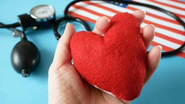 National american flag and heart. american heart month in February. Concept