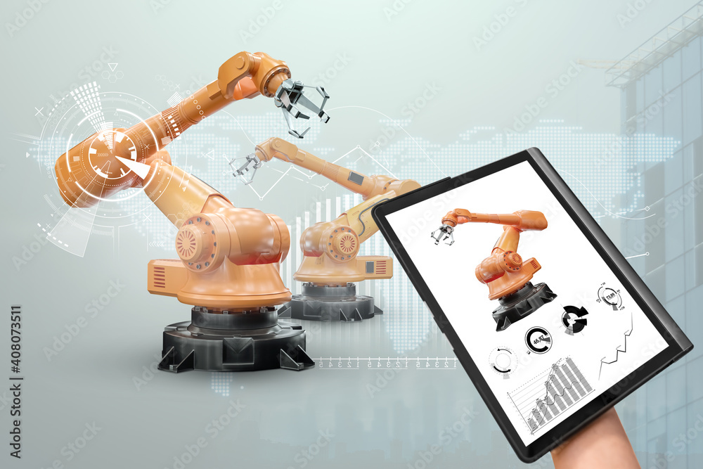 Wall mural A tablet in a man's hand controlling robotic arms in a modern factory. Iot technology concept, smart factory. Digital manufacturing operation. Industry 4.0