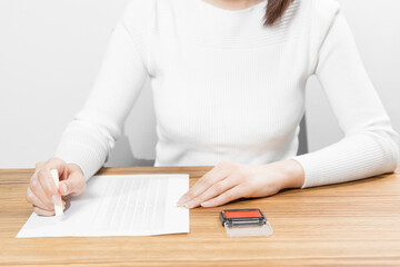 Woman stamping a name seal