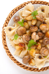 Pasta farfalle with grilled mushrooms and onions with spice, fresh parsley and onions