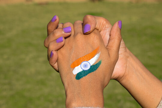 Indian Flag Tattoo Of Tri Colour Painted On Person's Hand Cheering And Celebrating Indian Republic Day