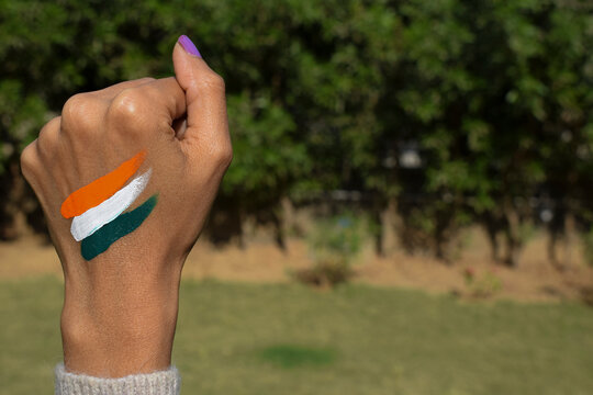 Indian Flag Tattoo Of Tri Colour Painted On Person's Hand Cheering And Celebrating Indian Republic Day