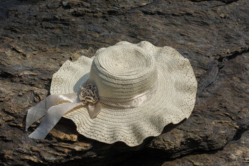 The hat is placed on the stone floor.