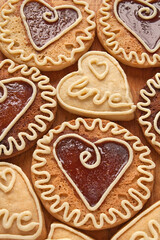 Homemade cookies with caramel in the center of the heart shaped, ornament with white chocolate