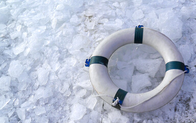 A lifebelt on the ice swimming spot at wintery beach