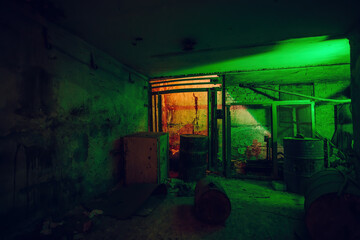 Fototapeta na wymiar Old broken dirty abandoned industrial building basement, illuminated by color lamp